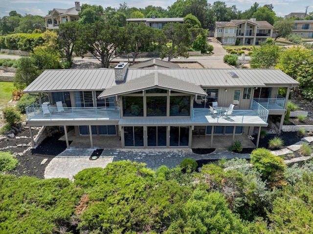 717 Mariner, Lakeway, TX 78734 - rear view of property with a balcony, a patio area, and metal roof
