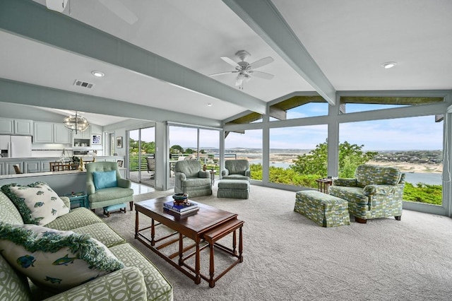 717 Mariner, Lakeway, TX 78734 - living room with plenty of natural light, a ceiling fan, carpet flooring, and floor to ceiling windows