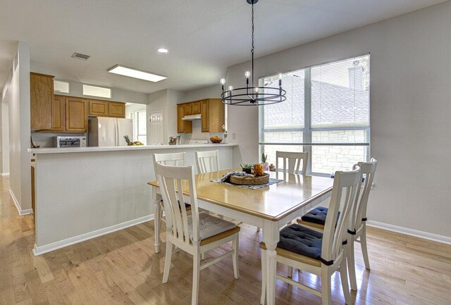 15053 Haley Holw, Austin, TX 78728 - dining area with a chandelier, light wood-style floors, baseboards, and recessed lighting