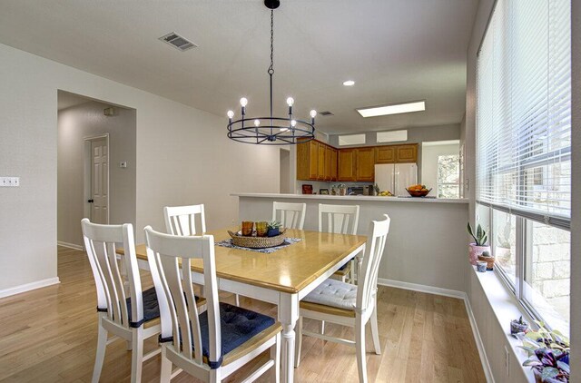 15053 Haley Holw, Austin, TX 78728 - dining space featuring a chandelier, light wood-style flooring, baseboards, and recessed lighting