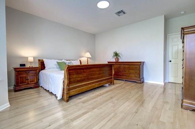 15053 Haley Holw, Austin, TX 78728 - bedroom featuring light wood finished floors and baseboards