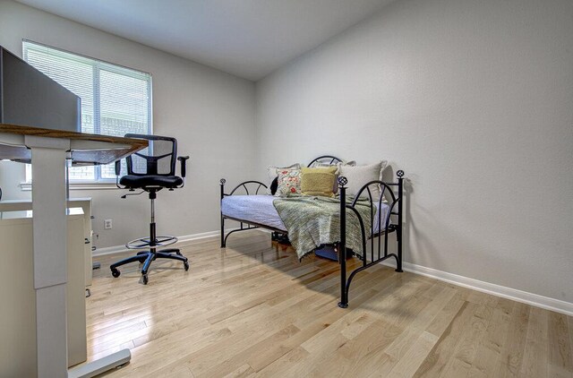 15053 Haley Holw, Austin, TX 78728 - bedroom featuring wood finished floors and baseboards