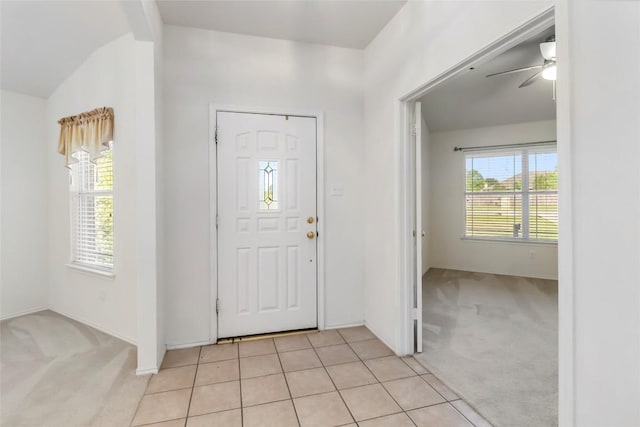 201 Murchison Dr, Cedar Creek, TX 78612 - foyer entrance with light carpet, ceiling fan, lofted ceiling, and baseboards