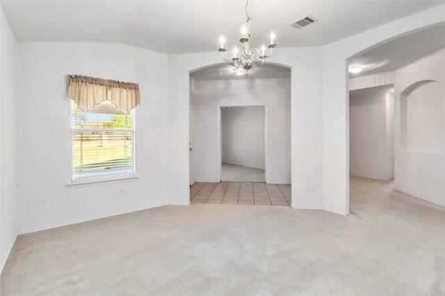 201 Murchison Dr, Cedar Creek, TX 78612 - unfurnished dining area featuring a chandelier, carpet flooring, arched walkways, vaulted ceiling, and baseboards