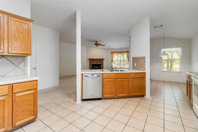 201 Murchison Dr, Cedar Creek, TX 78612 - kitchen featuring dishwasher, a sink, a ceiling fan, a fireplace, and light countertops