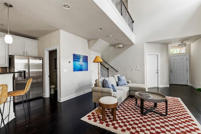 7709 Menchaca Rd Unit 14, Austin, TX 78745 - living area featuring dark wood-style flooring, stairs, and recessed lighting