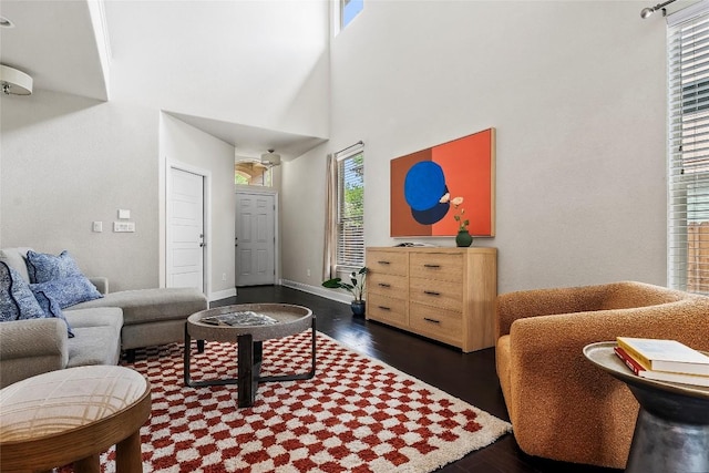 7709 Menchaca Rd Unit 14, Austin, TX 78745 - living area featuring plenty of natural light, dark wood finished floors, and a towering ceiling