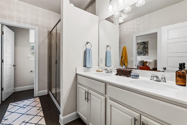 7709 Menchaca Rd Unit 14, Austin, TX 78745 - full bath with a shower stall, double vanity, and wood finished floors