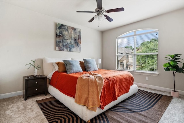 7709 Menchaca Rd Unit 14, Austin, TX 78745 - bedroom featuring light carpet and ceiling fan