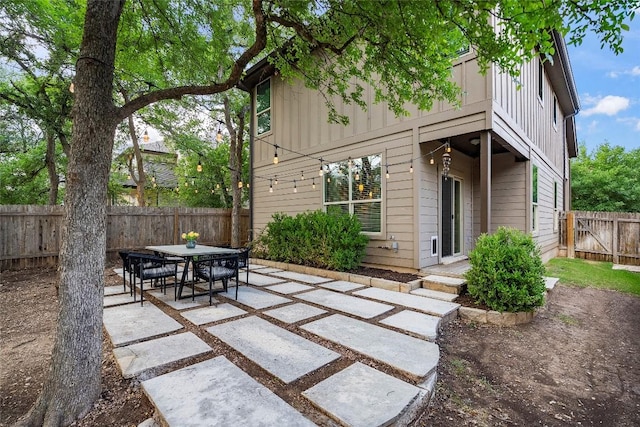 7709 Menchaca Rd Unit 14, Austin, TX 78745 - fenced backyard featuring a patio and outdoor dining area