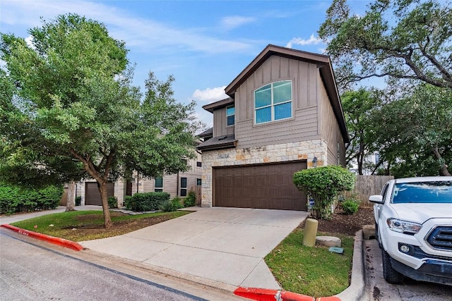 7709 Menchaca Rd Unit 14, Austin, TX 78745 - view of front of house with stone siding, board and batten siding, a garage, and concrete driveway