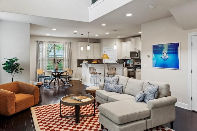 7709 Menchaca Rd Unit 14, Austin, TX 78745 - living area with dark wood-style flooring and recessed lighting