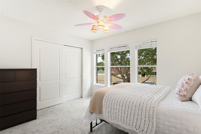 2105 Zeppelin Dr, Cedar Park, TX 78613 - carpeted bedroom with a closet and ceiling fan