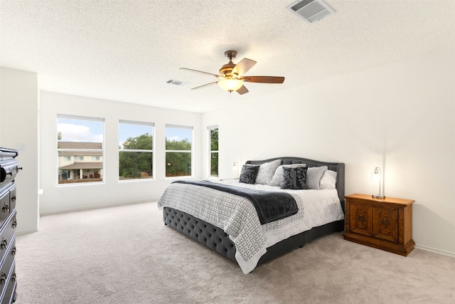 2105 Zeppelin Dr, Cedar Park, TX 78613 - carpeted bedroom with a ceiling fan and a textured ceiling