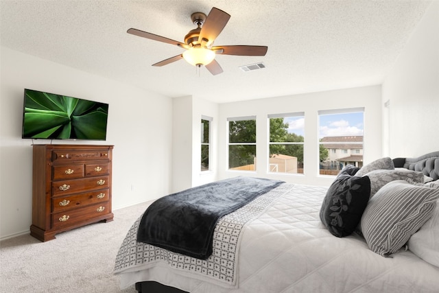 2105 Zeppelin Dr, Cedar Park, TX 78613 - carpeted bedroom featuring ceiling fan and a textured ceiling
