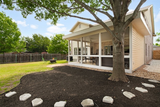 2105 Zeppelin Dr, Cedar Park, TX 78613 - back of house with a patio area, a sunroom, a fenced backyard, brick siding, and a ceiling fan