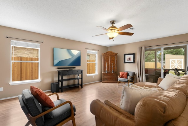 2105 Zeppelin Dr, Cedar Park, TX 78613 - living room with healthy amount of natural light, a ceiling fan, and wood finished floors