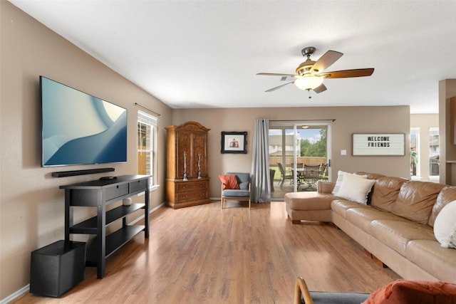 2105 Zeppelin Dr, Cedar Park, TX 78613 - living area with light wood-type flooring, ceiling fan, healthy amount of natural light, and baseboards