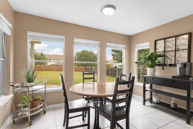 2105 Zeppelin Dr, Cedar Park, TX 78613 - dining room with plenty of natural light, baseboards, light tile patterned floors, and a textured ceiling