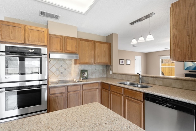 2105 Zeppelin Dr, Cedar Park, TX 78613 - kitchen featuring stainless steel appliances, a sink, light countertops, and tasteful backsplash