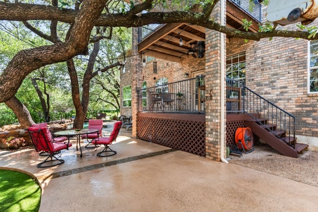 102 Cheerful Ct, Lakeway, TX 78734 - view of patio / terrace featuring outdoor dining area, stairway, and a balcony