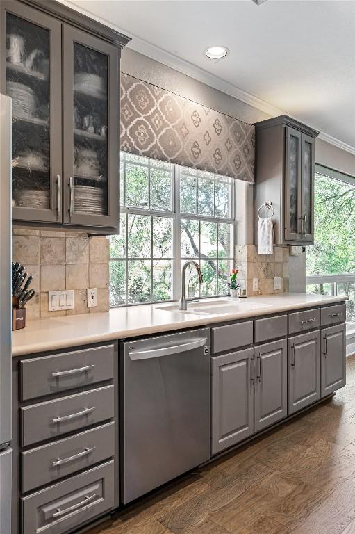 102 Cheerful Ct, Lakeway, TX 78734 - kitchen featuring stainless steel dishwasher, ornamental molding, gray cabinets, a sink, and recessed lighting
