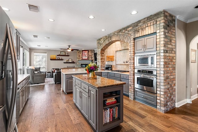102 Cheerful Ct, Lakeway, TX 78734 - kitchen featuring gray cabinetry, appliances with stainless steel finishes, ceiling fan, a center island, and recessed lighting