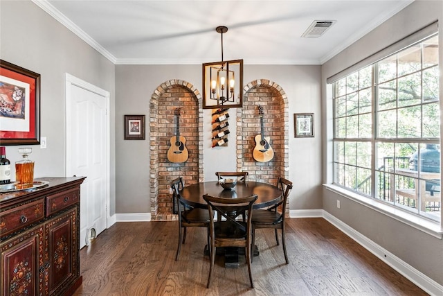 102 Cheerful Ct, Lakeway, TX 78734 - dining area featuring dark wood-type flooring, plenty of natural light, a chandelier, baseboards, and crown molding
