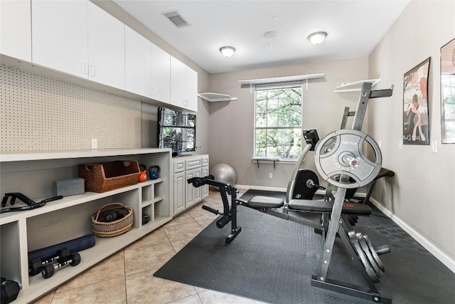 102 Cheerful Ct, Lakeway, TX 78734 - workout room featuring baseboards and light tile patterned floors