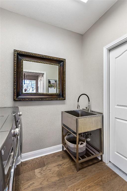 102 Cheerful Ct, Lakeway, TX 78734 - bathroom with baseboards and wood finished floors