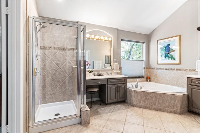 102 Cheerful Ct, Lakeway, TX 78734 - full bath featuring vanity, a garden tub, a shower stall, lofted ceiling, and tile patterned floors