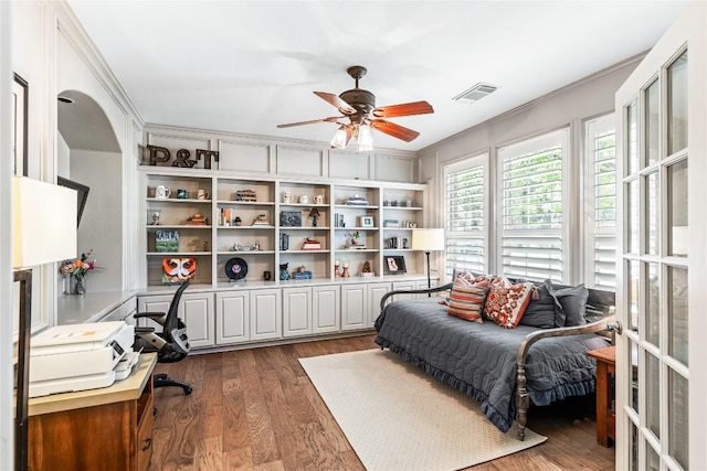 102 Cheerful Ct, Lakeway, TX 78734 - bedroom with dark wood finished floors, a ceiling fan, and an office area