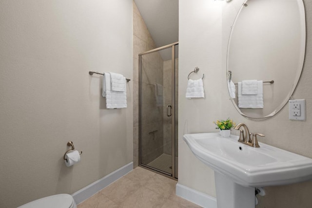 143 Pink Granite Blvd, Dripping Springs, TX 78620 - full bathroom with a shower stall, baseboards, toilet, a sink, and tile patterned floors