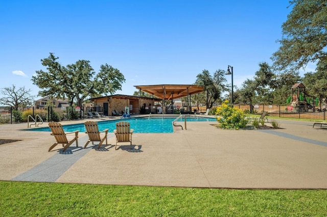 143 Pink Granite Blvd, Dripping Springs, TX 78620 - community pool featuring a patio area