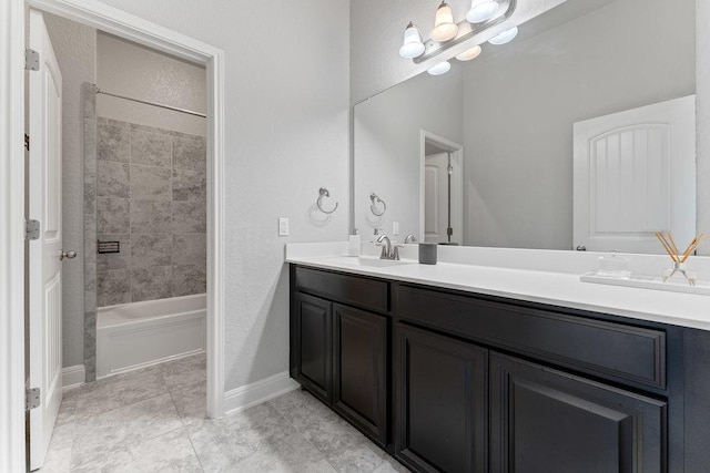 13911 Tribeca, San Antonio, TX 78245 - bathroom with double vanity, baseboards,  shower combination, and tile patterned floors