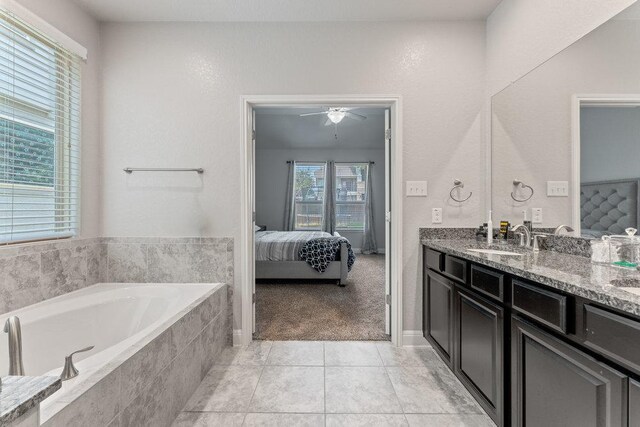 13911 Tribeca, San Antonio, TX 78245 - ensuite bathroom with a bath, double vanity, ceiling fan, and tile patterned floors