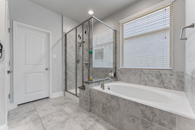 13911 Tribeca, San Antonio, TX 78245 - full bathroom featuring a garden tub, a stall shower, and tile patterned floors
