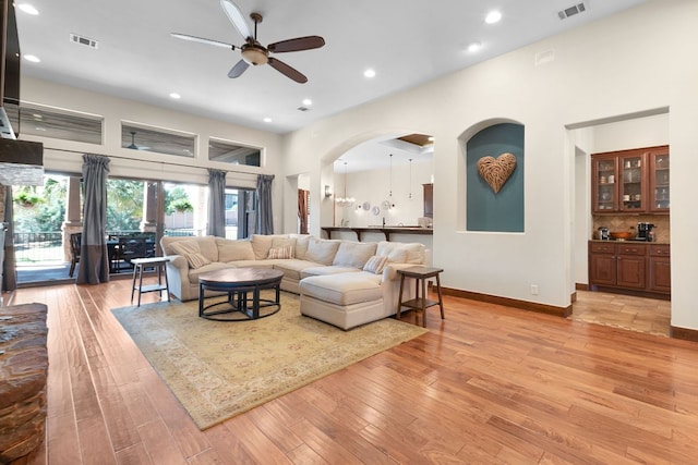 2904 Kodiak Cv, Cedar Park, TX 78613 - living area featuring a ceiling fan, light wood-style flooring, arched walkways, and recessed lighting