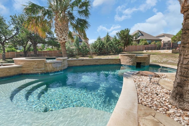 2904 Kodiak Cv, Cedar Park, TX 78613 - view of swimming pool with a pool with connected hot tub and a fenced backyard