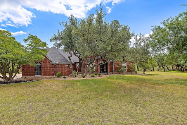 10003 Baxter Ln, Austin, TX 78736 - view of front of home featuring a front lawn and brick siding