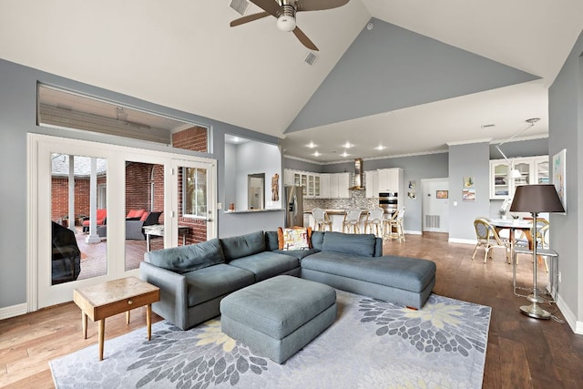 10003 Baxter Ln, Austin, TX 78736 - living room with a ceiling fan, dark wood finished floors, high vaulted ceiling, crown molding, and recessed lighting