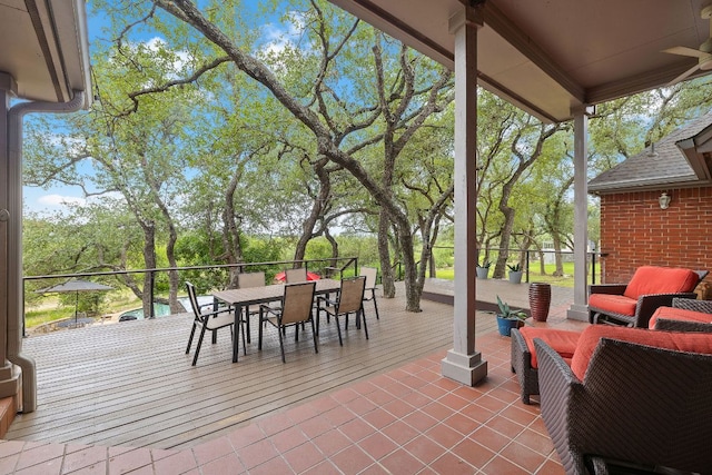 10003 Baxter Ln, Austin, TX 78736 - view of patio / terrace featuring outdoor dining space, ceiling fan, and view of scattered trees