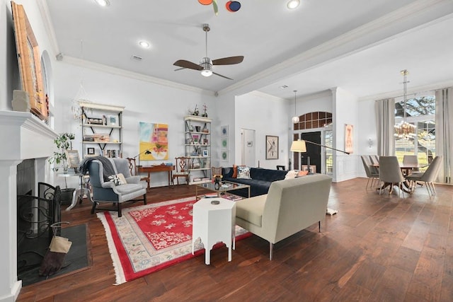 10003 Baxter Ln, Austin, TX 78736 - living room with a fireplace, ornamental molding, ceiling fan, wood finished floors, and recessed lighting