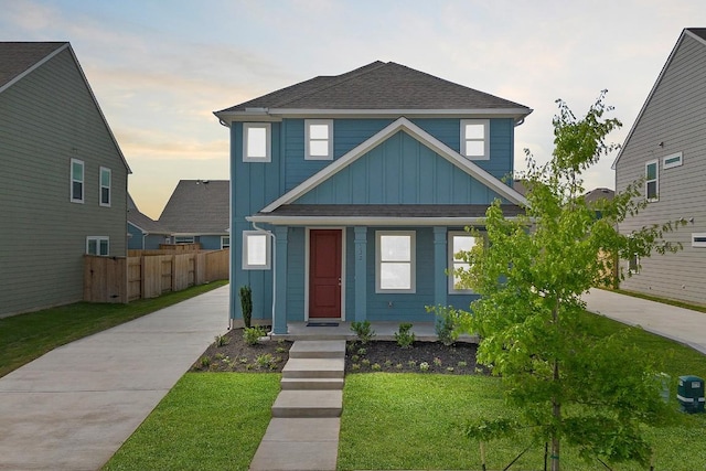 122 Elm Branch Trl, Taylor, TX 76574 - view of front of home with board and batten siding, covered porch, roof with shingles, and concrete driveway
