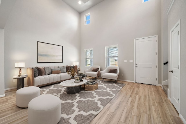 122 Elm Branch Trl, Taylor, TX 76574 - living room with plenty of natural light, a towering ceiling, light wood-type flooring, and recessed lighting