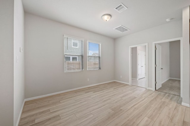 122 Elm Branch Trl, Taylor, TX 76574 - unfurnished bedroom with light wood finished floors and baseboards