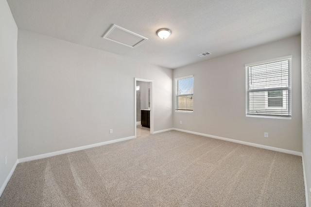 122 Elm Branch Trl, Taylor, TX 76574 - empty room with attic access and light carpet