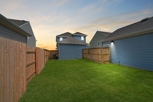 122 Elm Branch Trl, Taylor, TX 76574 - yard at dusk with a fenced backyard