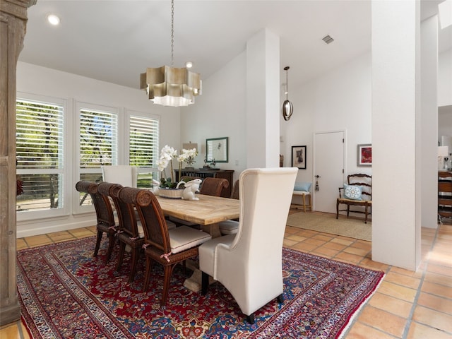 106 Southern Spur, Horseshoe Bay, TX 78657 - dining room with light tile patterned flooring, a chandelier, recessed lighting, and high vaulted ceiling