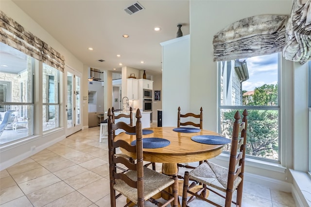 29 Tiburon Dr, The Hills, TX 78738 - dining space featuring plenty of natural light, baseboards, recessed lighting, and light tile patterned floors